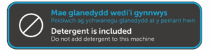 Image of 'detergent is included sticker shown on the machines.